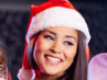 Lady wearing santa hat at christmas party