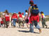 Children walk along beach at school camp