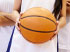 Girl holding Basketball at school sports